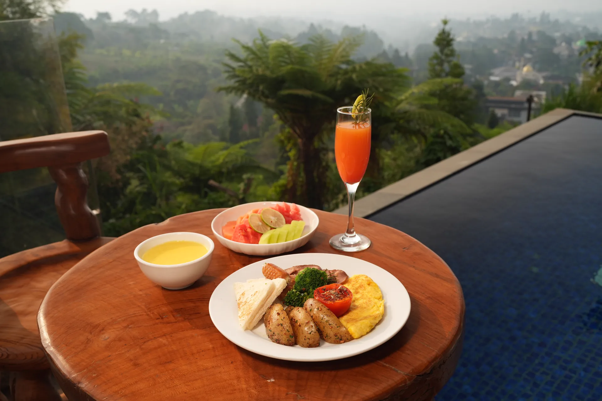 Breakfast by the pool overlooking the valley